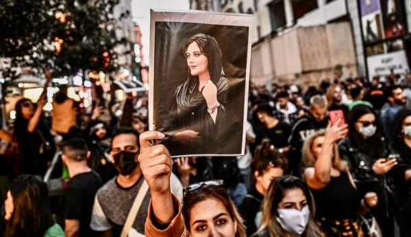 -- AFP PICTURES OF THE YEAR 2022 --

A protester holds a portrait of Mahsa Amini  during a demonstration in support of Amini, a young Iranian woman who died after being arrested in Tehran by the Islamic Republic's morality police, on Istiklal avenue in Istanbul on September 20, 2022.  Amini, 22, was on a visit with her family to the Iranian capital when she was detained on September 13 by the police unit responsible for enforcing Iran's strict dress code for women, including the wearing of the headscarf in public. She was declared dead on September 16 by state television after having spent three days in a coma. - AFP PICTURES OF THE YEAR 2022

 (Photo by Ozan KOSE / AFP) / AFP PICTURES OF THE YEAR 2022